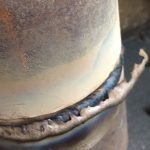 A pipe weld with the slag peeling off. A perfect weld.