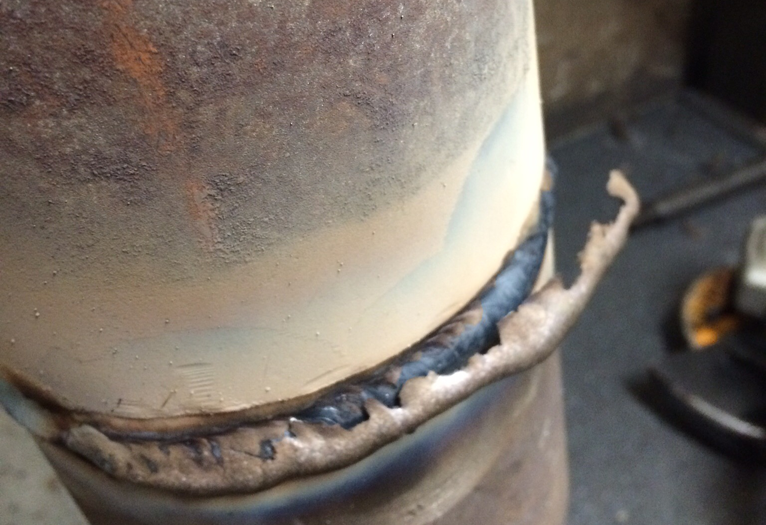A pipe weld with the slag peeling off. A perfect weld.